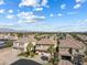 Expansive view of a residential neighborhood with uniform architecture, palm trees, and mountain backdrop at 5578 Holcomb Bridge Ct, Las Vegas, NV 89149