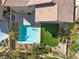 Aerial view of a backyard with a pool, turf lawn, and desert landscaping at 5578 Holcomb Bridge Ct, Las Vegas, NV 89149
