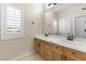 Bathroom with double sinks, stylish fixtures, and plantation shutters at 5578 Holcomb Bridge Ct, Las Vegas, NV 89149