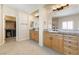 Bright bathroom features double sinks, tiled floors, and a walk-in closet nearby at 5578 Holcomb Bridge Ct, Las Vegas, NV 89149
