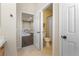 Open bathroom view showing toilet, doorway, and double sink at 5578 Holcomb Bridge Ct, Las Vegas, NV 89149