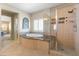 Luxurious bathroom featuring a jacuzzi tub and frameless glass shower at 5578 Holcomb Bridge Ct, Las Vegas, NV 89149