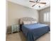 Bedroom with carpeted floor, ceiling fan, shuttered window and tasteful furniture at 5578 Holcomb Bridge Ct, Las Vegas, NV 89149