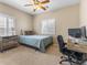 Cozy bedroom featuring neutral tones, plantation shutters, and a ceiling fan at 5578 Holcomb Bridge Ct, Las Vegas, NV 89149