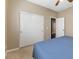 Bedroom with large closet and beige walls with carpeted floors at 5578 Holcomb Bridge Ct, Las Vegas, NV 89149
