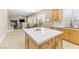 Bright kitchen with a white countertop island, stainless steel appliances, and views to dining area at 5578 Holcomb Bridge Ct, Las Vegas, NV 89149