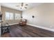 A sun-filled living room boasts a sleek TV console, natural light, and a cozy leather chair at 5578 Holcomb Bridge Ct, Las Vegas, NV 89149