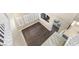 Top-down view of a living room showcasing hardwood floors, neutral walls, and staircase at 5578 Holcomb Bridge Ct, Las Vegas, NV 89149