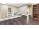 Spacious loft features wood floors, white banister, and large bookshelf at 5578 Holcomb Bridge Ct, Las Vegas, NV 89149