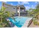 Beautiful backyard pool with a safety fence and patio area under a second story balcony at 5578 Holcomb Bridge Ct, Las Vegas, NV 89149