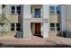 Inviting townhome showcasing a private balcony and welcoming brick entrance at 5733 Crenellated St # Lot 67, Las Vegas, NV 89148