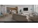 Open-concept living space featuring a dining area, kitchen, and comfortable seating arrangement at 5733 Crenellated St # Lot 67, Las Vegas, NV 89148