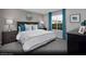 Comfortable primary bedroom with plush carpet, complemented by soft gray walls and natural lighting at 5745 Crenellated St # Lot 64, Las Vegas, NV 89148