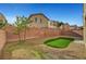 The backyard features low-maintenance gravel landscaping and a small area of artificial turf at 5829 Feral Garden St, North Las Vegas, NV 89031