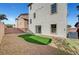 The backyard features a small area of artificial turf and low-maintenance gravel landscaping at 5829 Feral Garden St, North Las Vegas, NV 89031