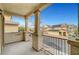Inviting balcony with sturdy columns, iron railing, and serene neighborhood views at 5829 Feral Garden St, North Las Vegas, NV 89031