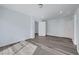 Spacious bedroom with wood-look floors and ample natural light at 5829 Feral Garden St, North Las Vegas, NV 89031