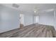 Spacious bonus room featuring wood-look flooring, neutral walls, and ample natural light at 5829 Feral Garden St, North Las Vegas, NV 89031