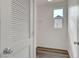 This storage closet has white shelving, a window, and luxury vinyl plank flooring at 5829 Feral Garden St, North Las Vegas, NV 89031