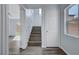 Welcoming entryway featuring a staircase and modern flooring at 5829 Feral Garden St, North Las Vegas, NV 89031