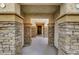 Covered entryway with stone pillars and a view of the front door at 5829 Feral Garden St, North Las Vegas, NV 89031