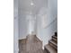 Hallway with wood-look floors and stairs leading to the upper level of the home at 5829 Feral Garden St, North Las Vegas, NV 89031