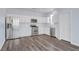 Modern kitchen with white cabinetry, stainless steel appliances, and ample counter space at 5829 Feral Garden St, North Las Vegas, NV 89031