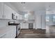 Modern kitchen featuring white cabinets, stainless steel appliances, and stylish countertops and backsplash at 5829 Feral Garden St, North Las Vegas, NV 89031