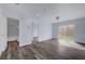 A bright living room with access to a bathroom and sliding glass doors to backyard at 5829 Feral Garden St, North Las Vegas, NV 89031