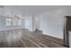 Open-concept living room features ample natural light, wood-look flooring, and neutral walls at 5829 Feral Garden St, North Las Vegas, NV 89031