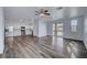 Spacious living area featuring a modern kitchen, stainless appliances, and balcony access at 5829 Feral Garden St, North Las Vegas, NV 89031