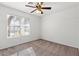 Bright bedroom featuring a ceiling fan and large window at 6037 Soft Springs Ave, Las Vegas, NV 89130