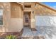 Close up of front door and two-car garage at 6037 Soft Springs Ave, Las Vegas, NV 89130