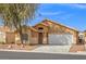 Inviting single-story home with desert landscaping and a two-car garage at 6037 Soft Springs Ave, Las Vegas, NV 89130