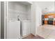 Convenient laundry room with modern washer and dryer, and storage space at 6037 Soft Springs Ave, Las Vegas, NV 89130