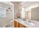 Bright bathroom features a double sink vanity, large mirror, and decorative wall accents at 6066 El Sol Dr, Las Vegas, NV 89142