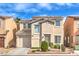 Charming two-story home featuring a private garage and front yard landscaping at 6066 El Sol Dr, Las Vegas, NV 89142