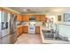 Spacious kitchen area with stainless steel refrigerator and abundant countertop space at 6066 El Sol Dr, Las Vegas, NV 89142