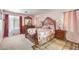Comfortable bedroom with soft carpet, a decorative headboard, and matching nightstands at 6066 El Sol Dr, Las Vegas, NV 89142