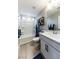 Modern bathroom features a white vanity, framed mirror, and bath-shower combination at 618 Steep Canyon Ave, Las Vegas, NV 89183