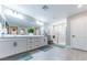 Modern bathroom features double vanity, a glass-enclosed shower, and sleek finishes throughout at 618 Steep Canyon Ave, Las Vegas, NV 89183