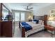 Comfortable bedroom with a plush bed, dresser, and large windows offering natural light at 618 Steep Canyon Ave, Las Vegas, NV 89183