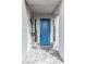Charming front entrance with a blue door, modern sconces, and decorative flowerpots at 618 Steep Canyon Ave, Las Vegas, NV 89183