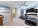 A home gym with various fitness equipment, neutral color scheme, and ample space at 618 Steep Canyon Ave, Las Vegas, NV 89183