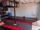 Well-organized garage with a patterned floor, storage shelves, and ample space at 618 Steep Canyon Ave, Las Vegas, NV 89183