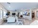 Open-concept living area with a view of the dining room and staircase, filled with light at 618 Steep Canyon Ave, Las Vegas, NV 89183
