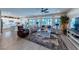 An open-concept living room with tile floors, lots of sunlight, and comfortable seating at 618 Steep Canyon Ave, Las Vegas, NV 89183