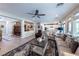 Spacious living room that connects to a dining area and kitchen, filled with natural light at 618 Steep Canyon Ave, Las Vegas, NV 89183