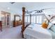 Spacious main bedroom with shuttered windows, a canopy bed, and soft light to create a relaxing atmosphere at 618 Steep Canyon Ave, Las Vegas, NV 89183