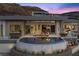 Stunning backyard with a pool, outdoor seating, and breathtaking views of the surrounding mountains at 629 Majestic Rim Dr, Henderson, NV 89012